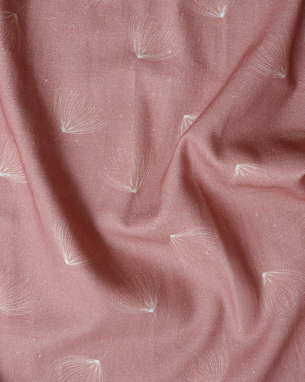 Brishti print fabric in dry-rose with fine linear, rain-inspired strokes; minimal, modern look. 
