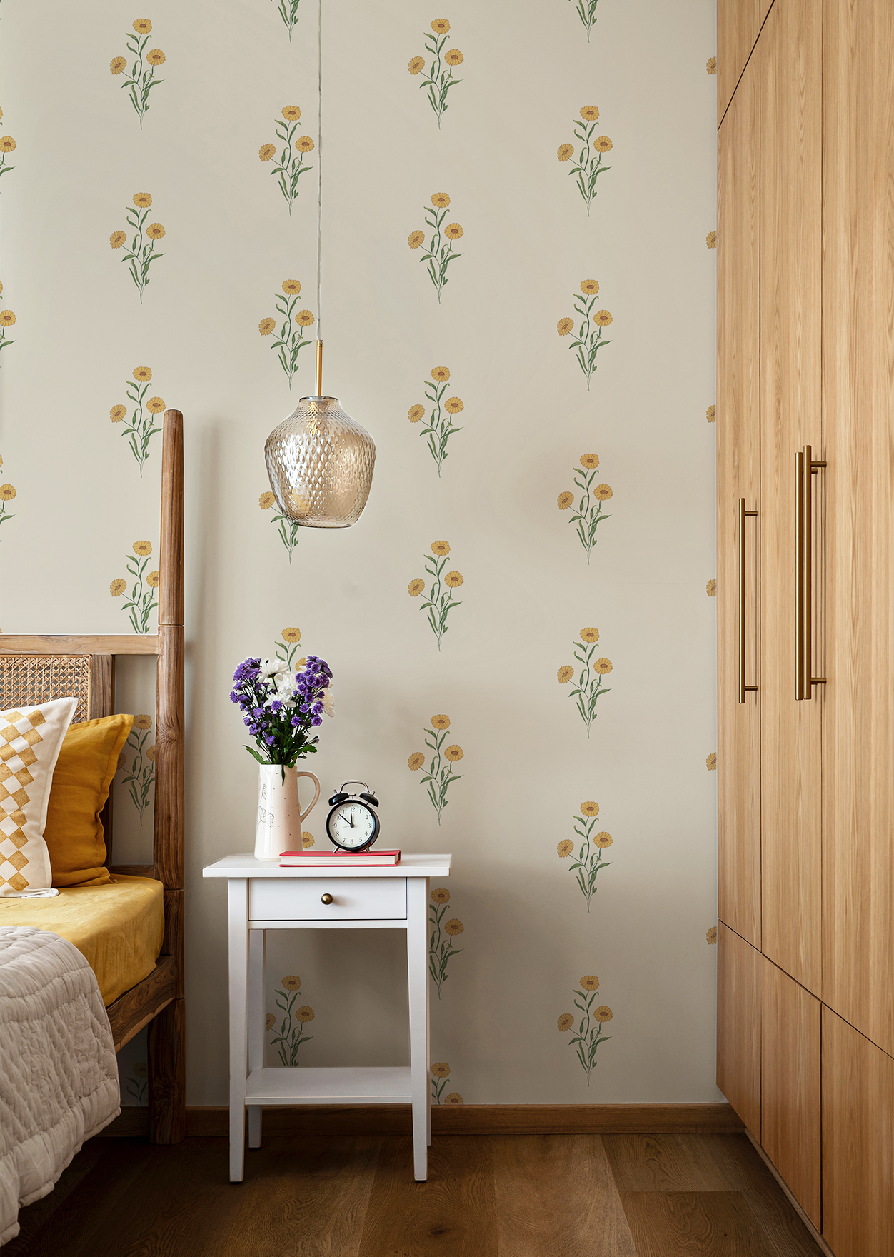 Marigold floral wallpaper in turmeric yellow with hand-drawn blooms and leaves. 