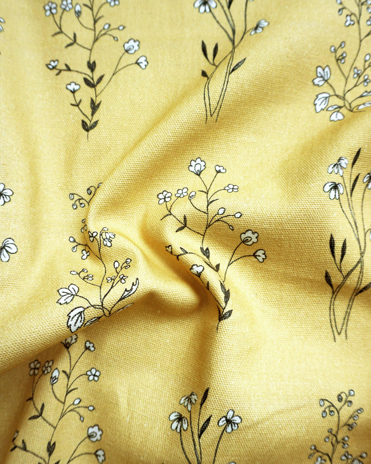 English Meadow print fabric in ochre with hand-drawn wildflowers; soft, nature-inspired pattern. 
