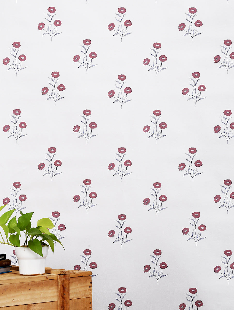 Marigold floral wallpaper in deep red with repeating hand-drawn flowers and foliage.