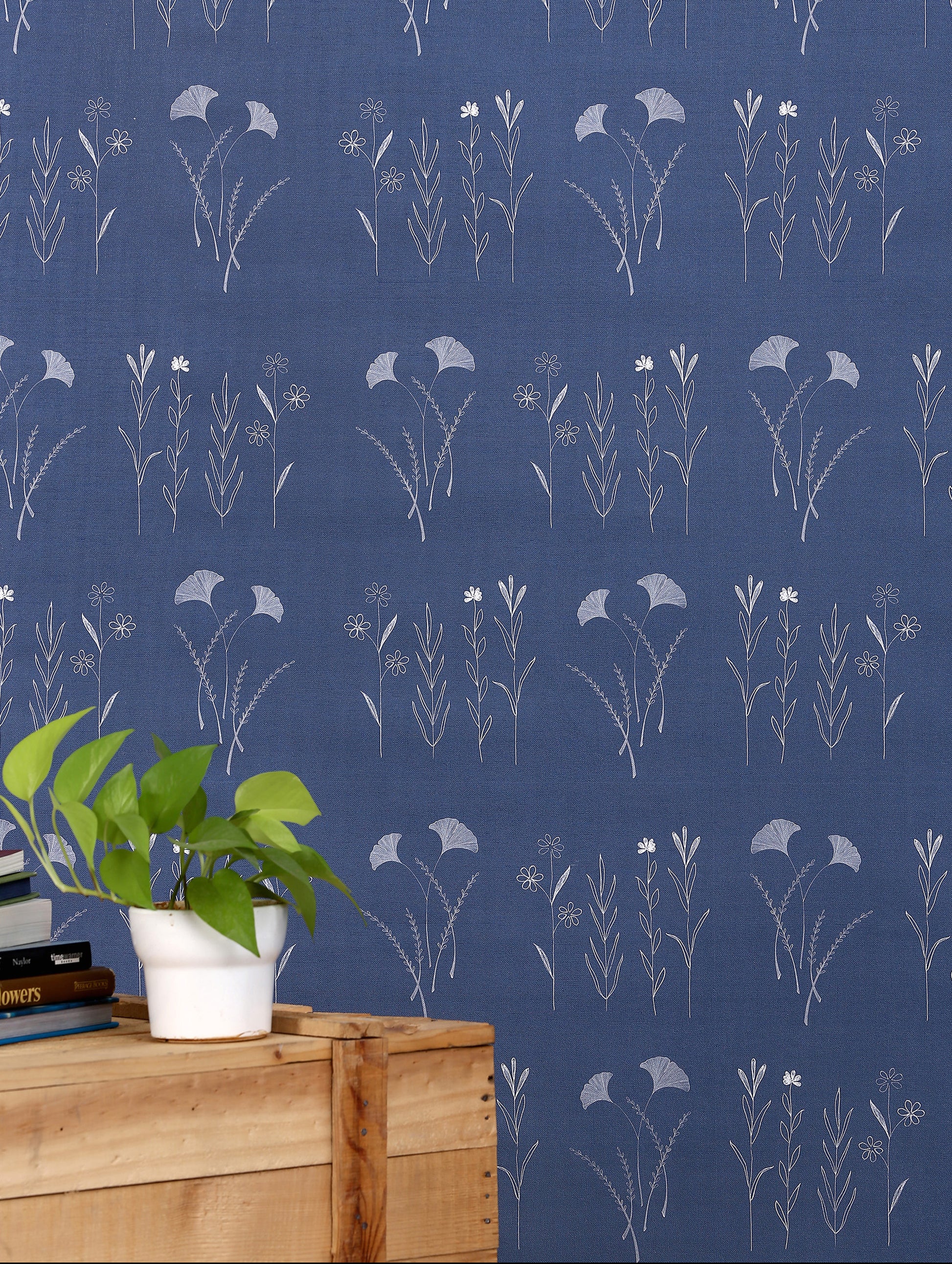 Mixed wildflower wallpaper with assorted hand-illustrated blooms and foliage in gentle tones.